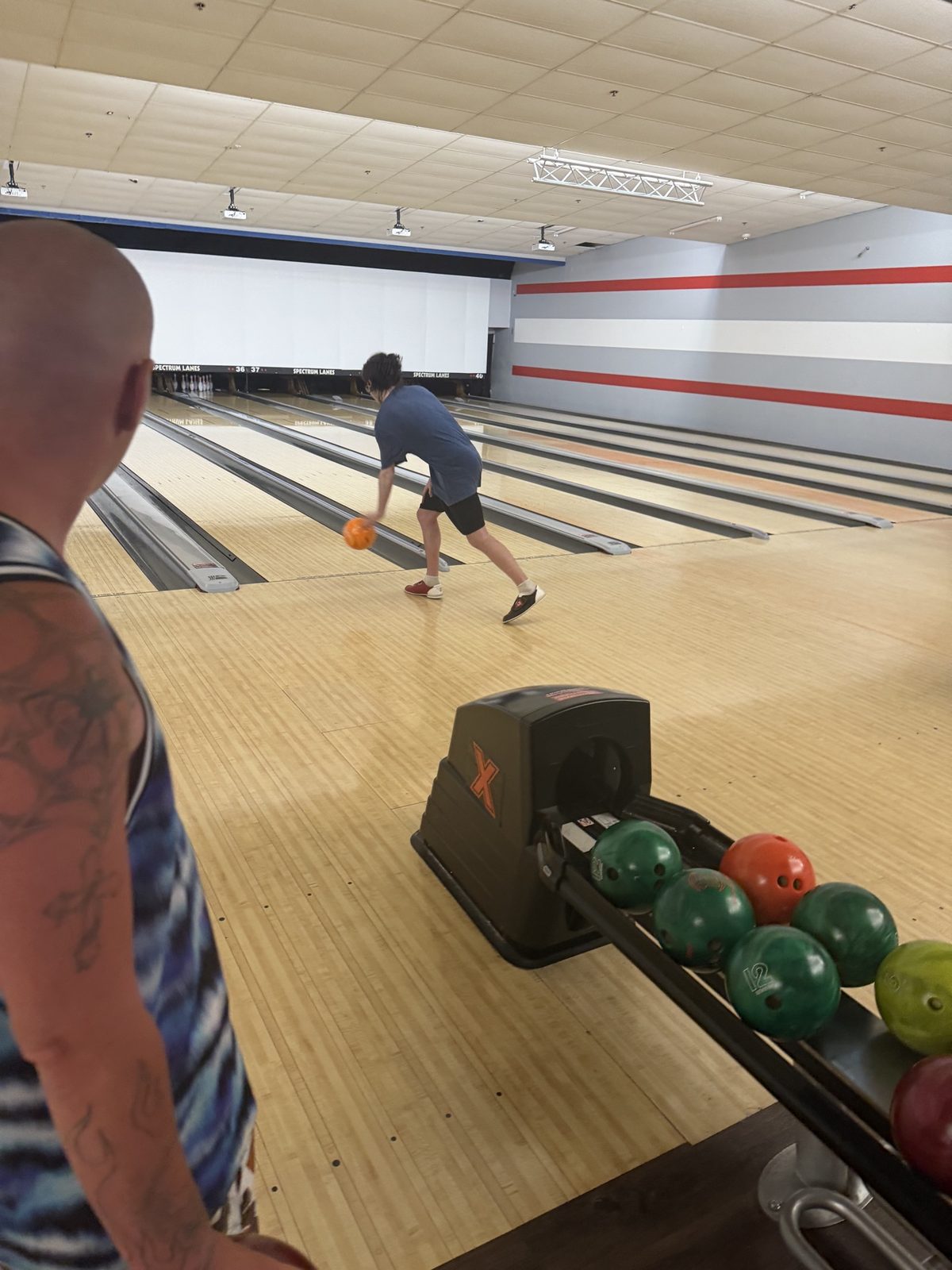 Residents bowling together at a bowling alley