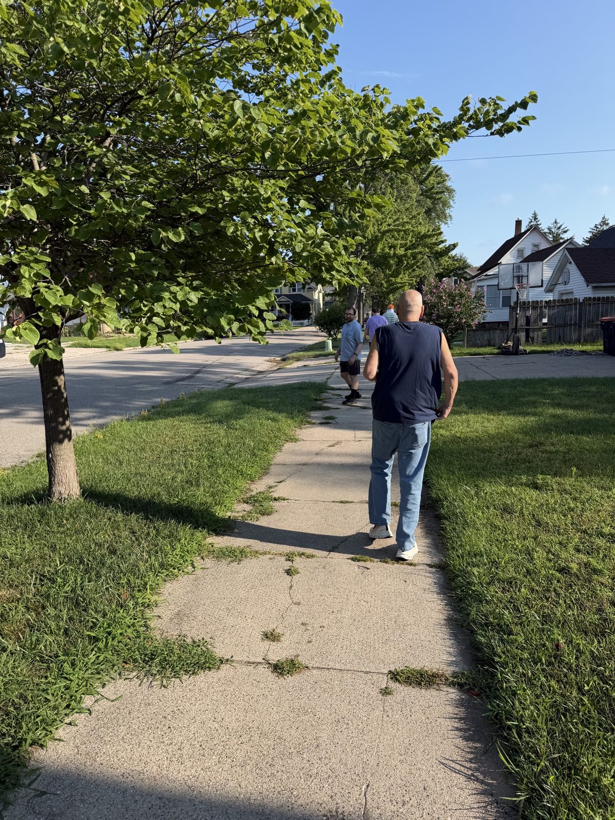 Residents taking a sunny walk through the neighborhood