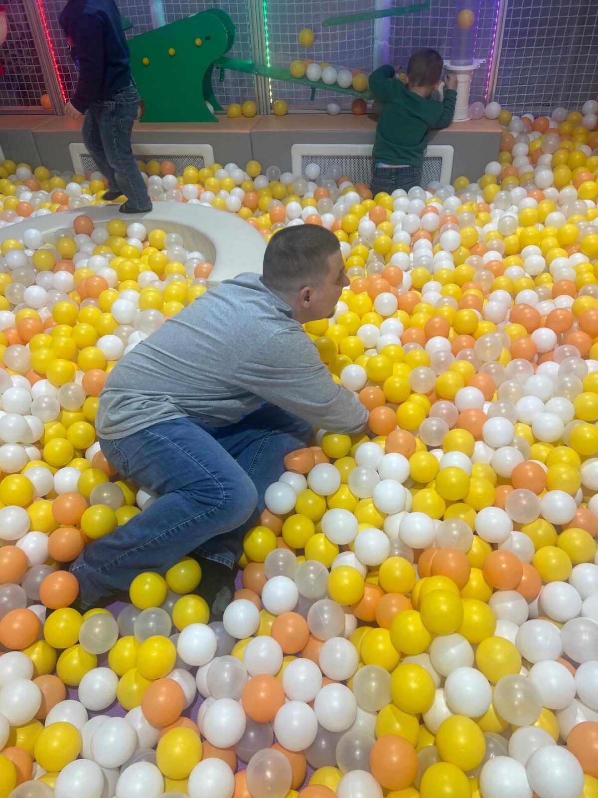 A Giddings AFC resident enjoying a colorful ball pit